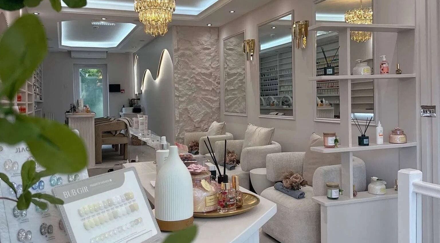 Chic interior of By Amarni Tian beauty salon in London, England, GB with plush chairs and tranquil ambiance.