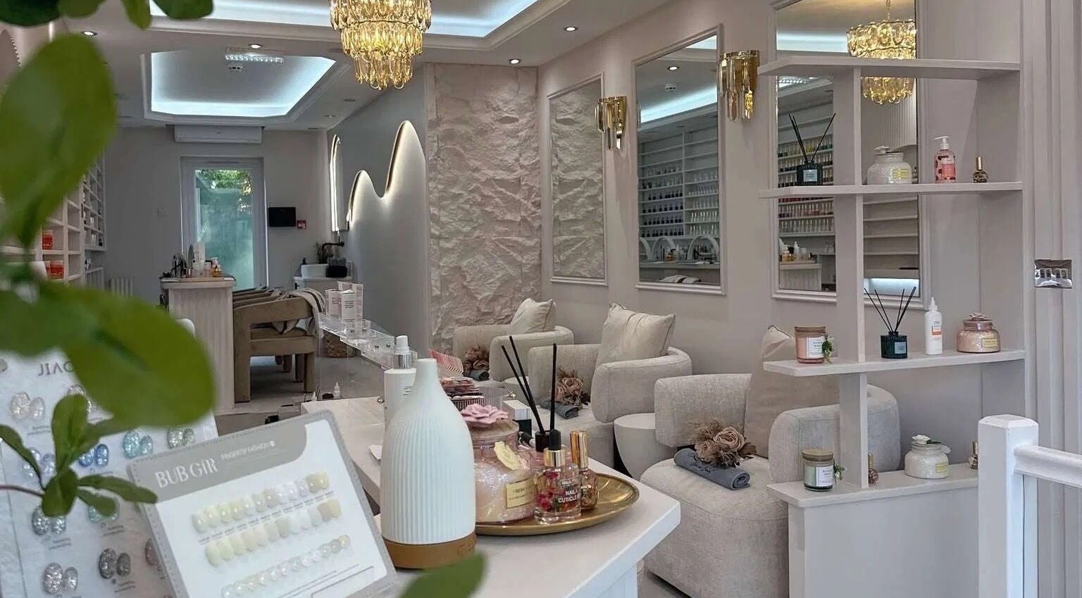 Chic interior of By Amarni Tian beauty salon in London, England, GB with plush chairs and tranquil ambiance.