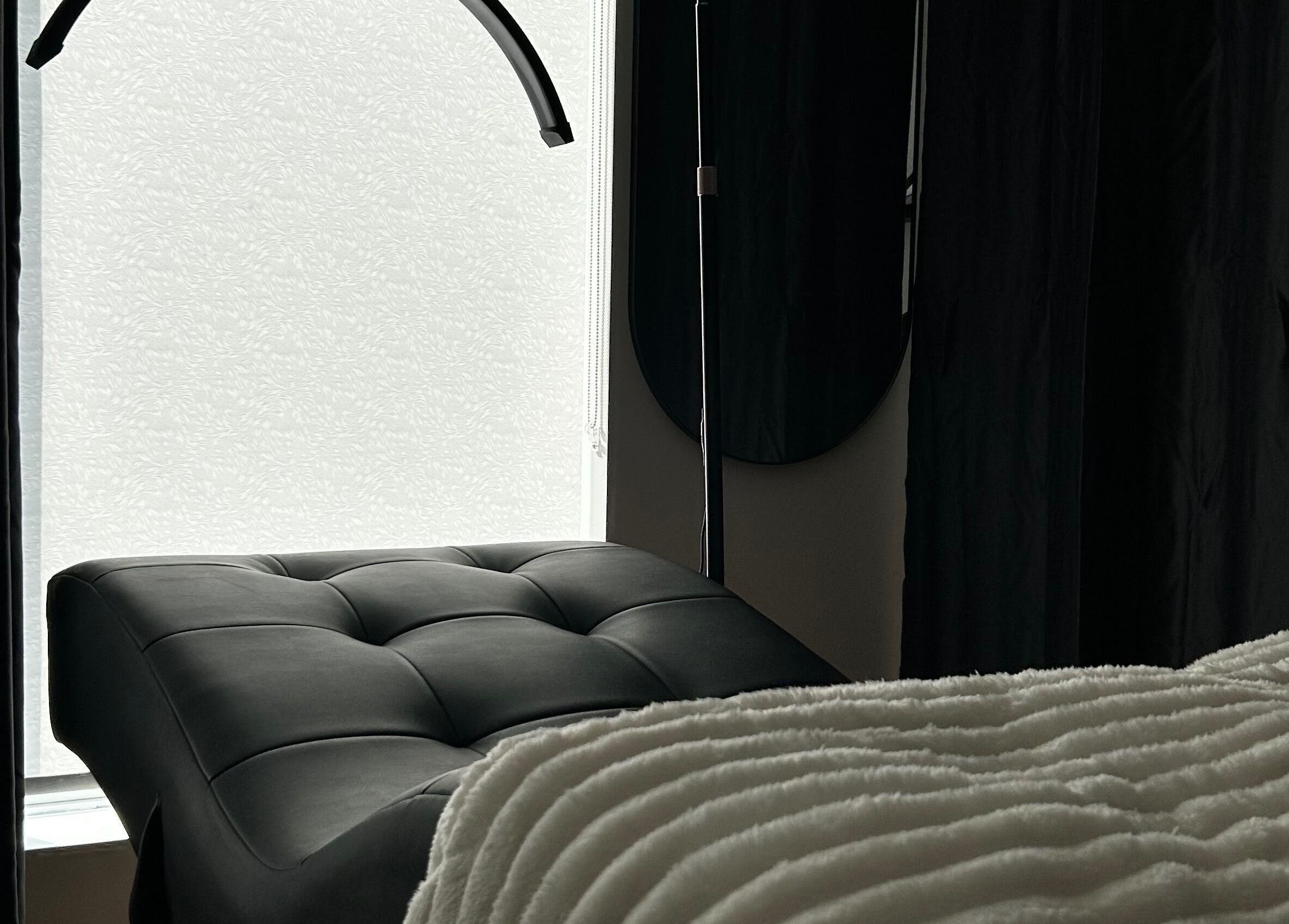 Luxurious spa bed at Aesthetics By Abbey in Gatineau, Québec, CA creating a tranquil atmosphere.