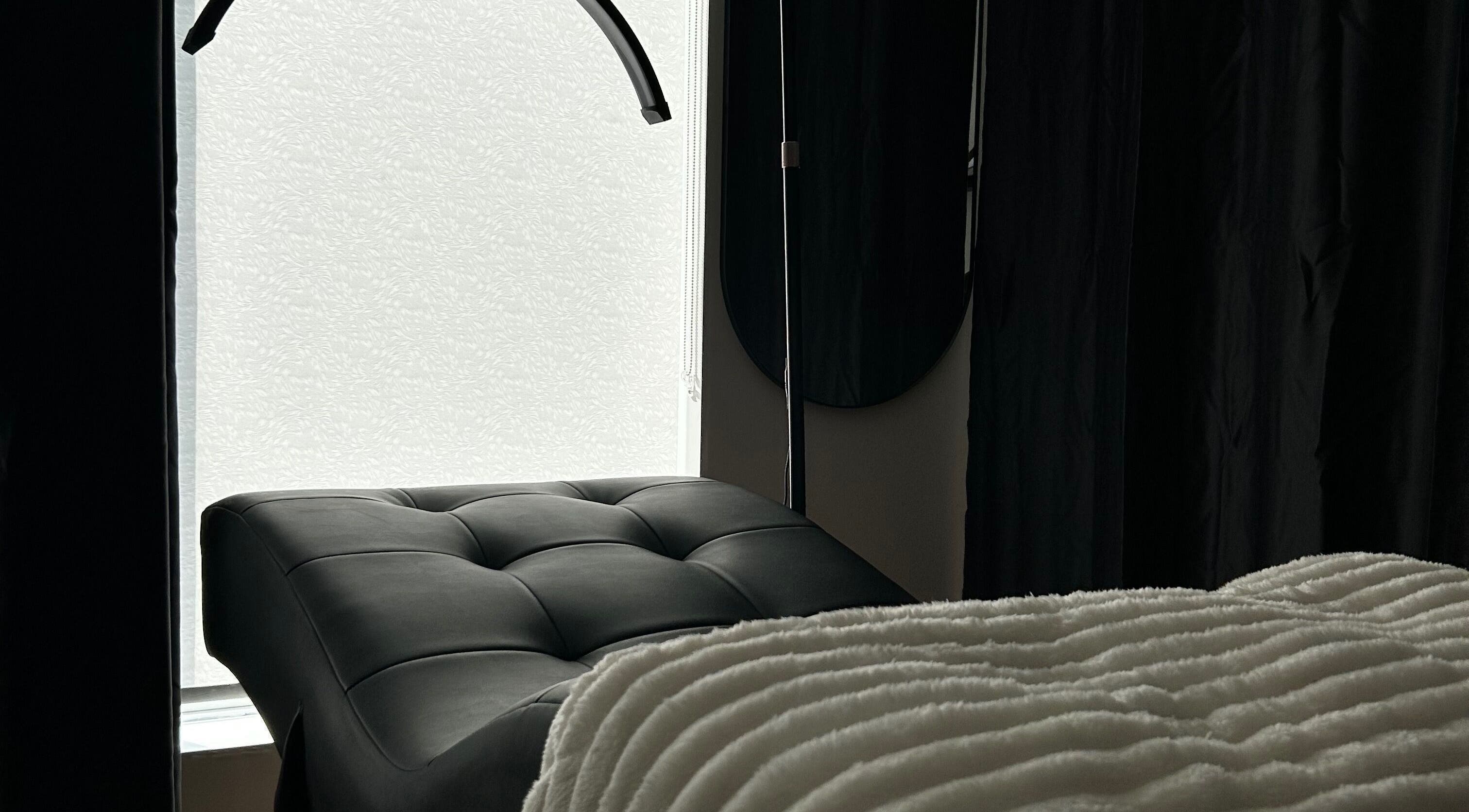 Luxurious spa bed at Aesthetics By Abbey in Gatineau, Québec, CA creating a tranquil atmosphere.