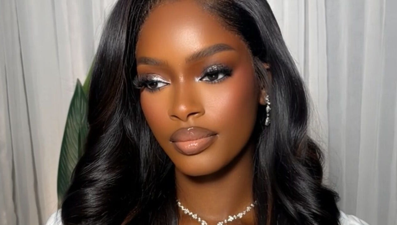 Elegant makeup look by Efoma’s Touch Artistry in Birmingham, England, GB. Stunning hairstyle and radiant skin.