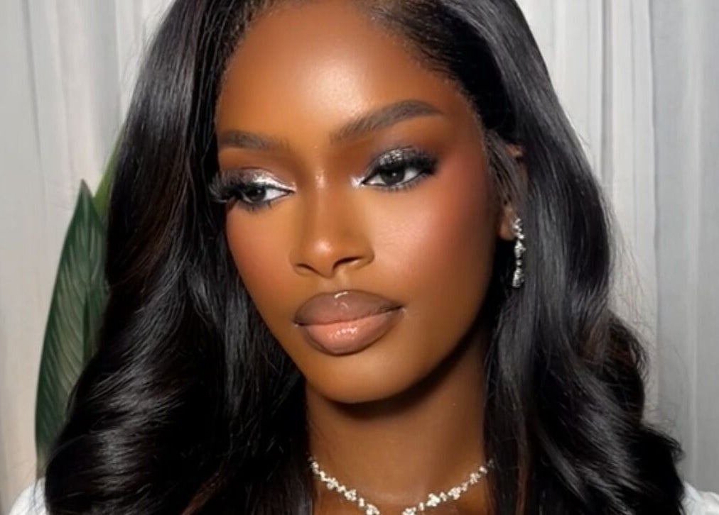 Elegant makeup look by Efoma’s Touch Artistry in Birmingham, England, GB. Stunning hairstyle and radiant skin.