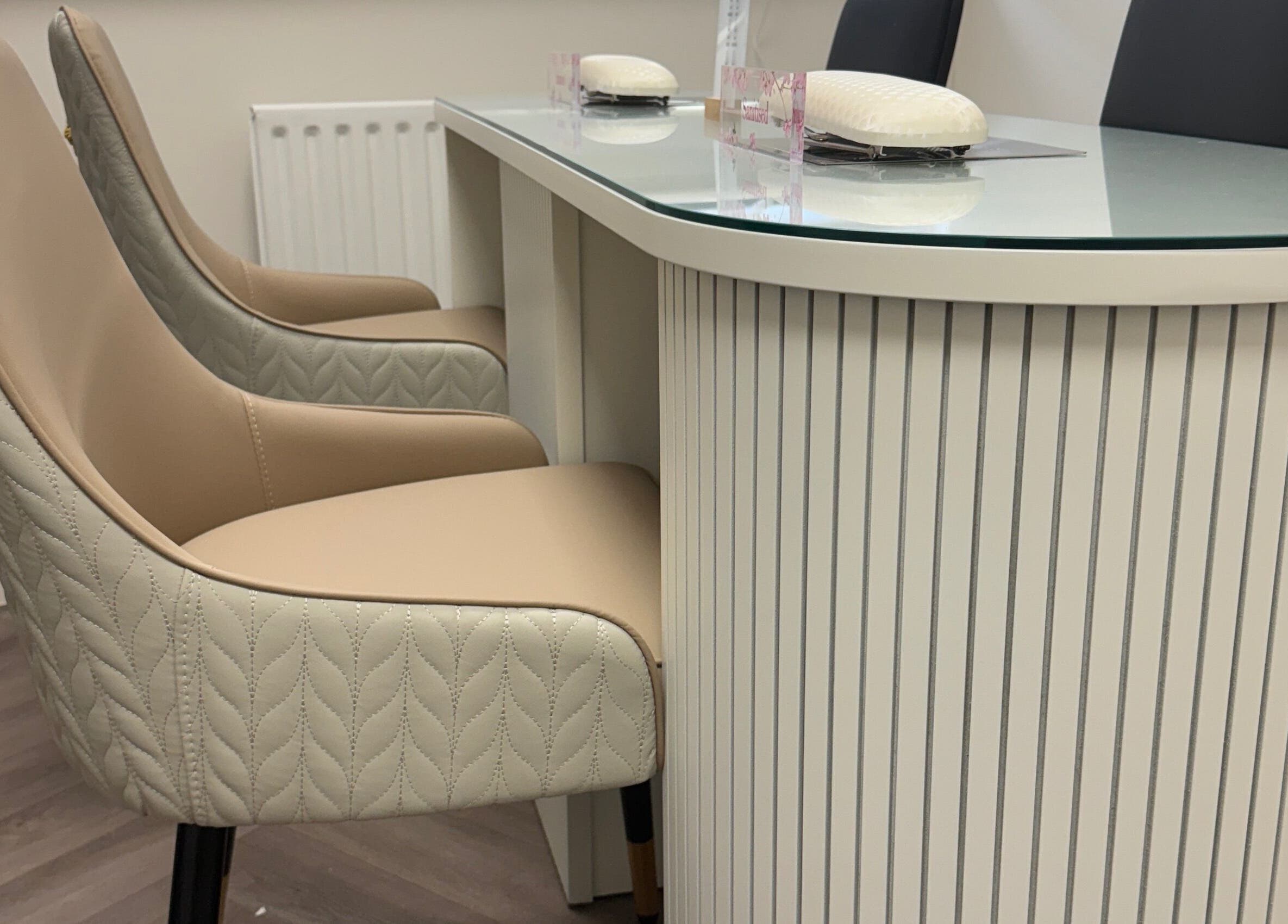 Luxhouse Nails modern manicure station in London, England, GB with elegant seating and sleek design.