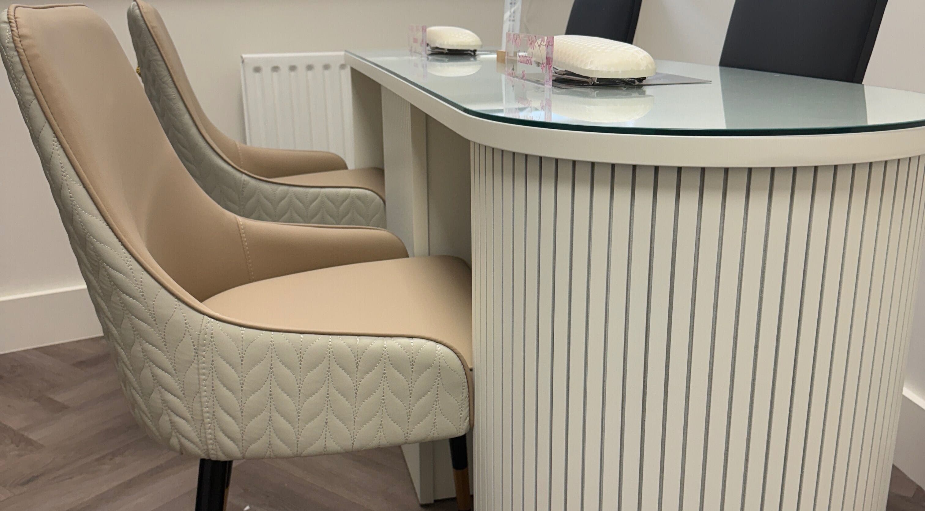 Luxhouse Nails modern manicure station in London, England, GB with elegant seating and sleek design.