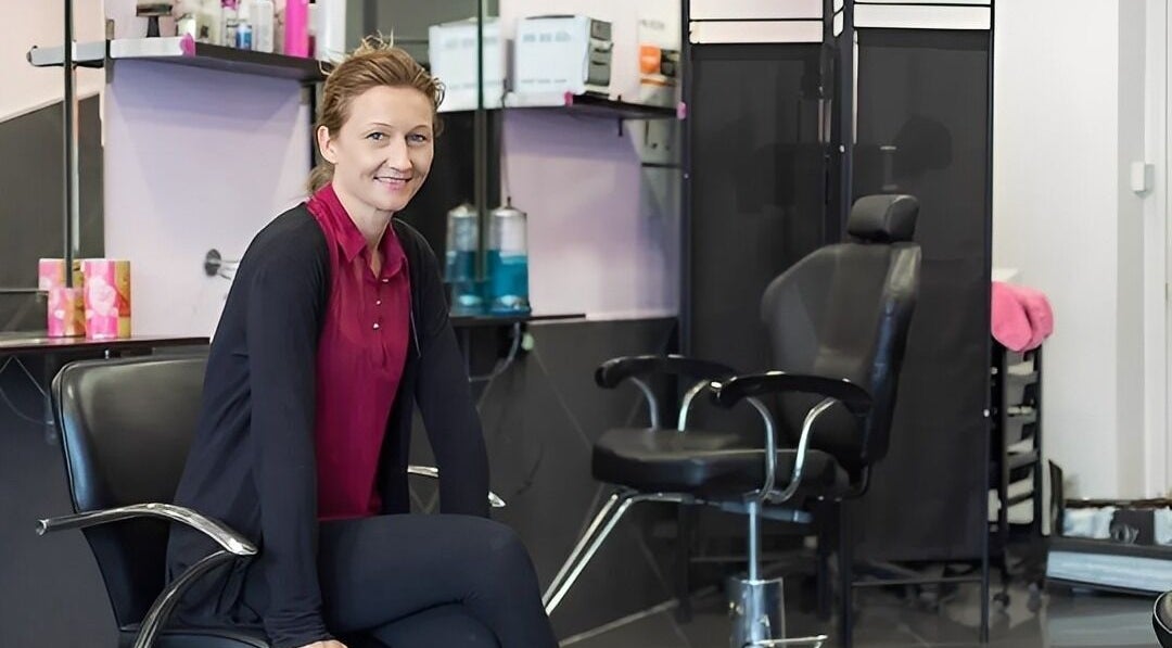 Professional stylist at XPRESSIONS HAIR & BEAUTY LTD in Hayes, England, GB inside the modern salon.