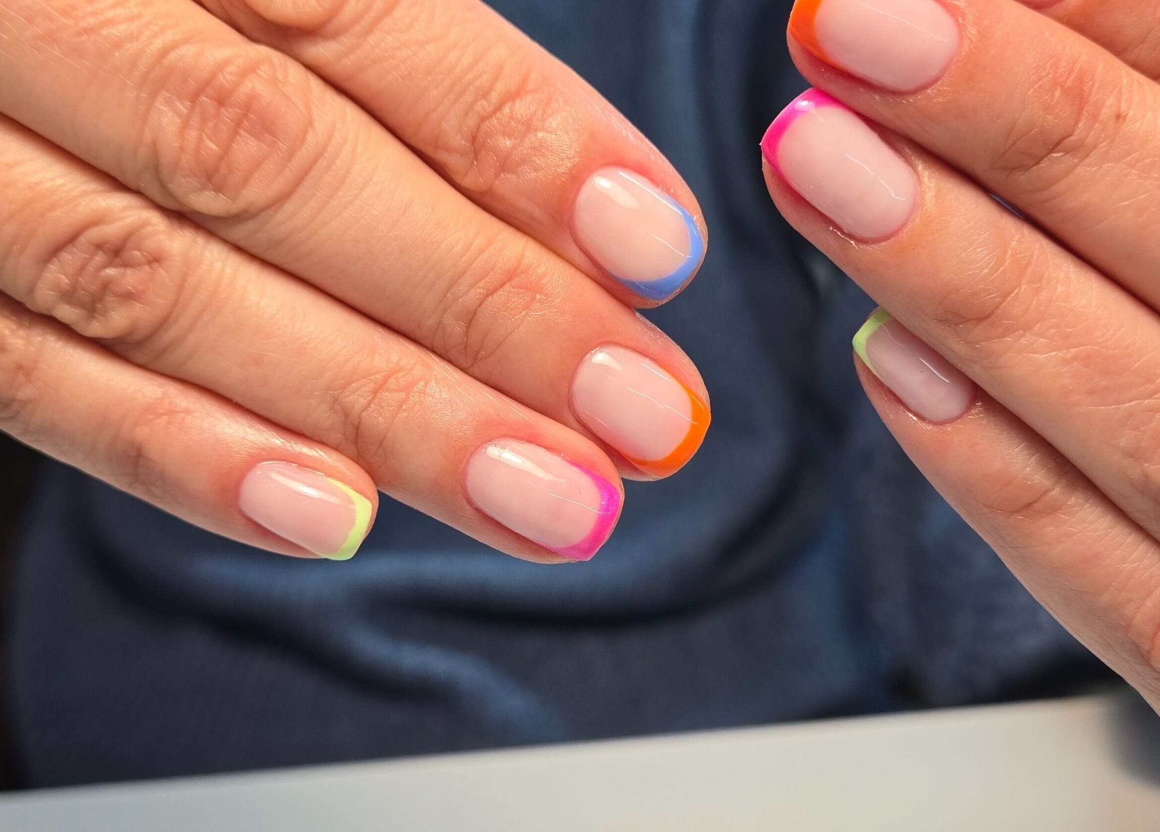 Colorful French manicure at Luana Alvarenga Nail Atelier, Lisboa, Lisboa, PT. Vibrant and stylish nail art.