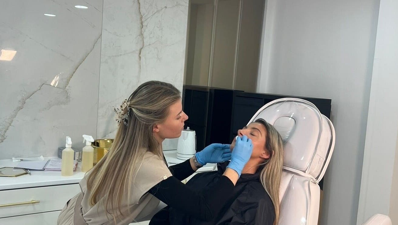 Facial treatment at Aura Skinn By Sandra, Buckhurst Hill, England, GB, showcasing expert skincare service.