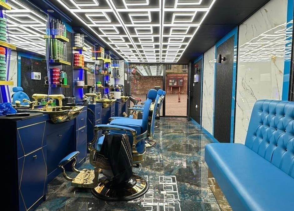 Sleek interior of Boss Barber in Ilkeston, England, GB showcasing plush seating and modern decor.