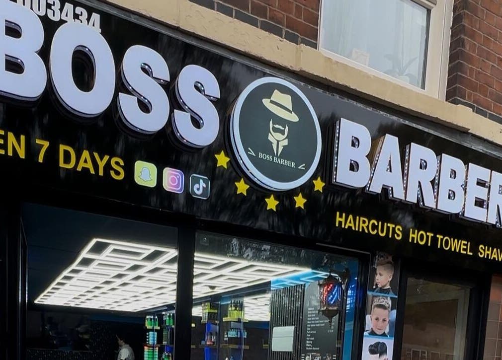 Front view of Boss Barber in Ilkeston, England showcasing a modern signboard and entry.