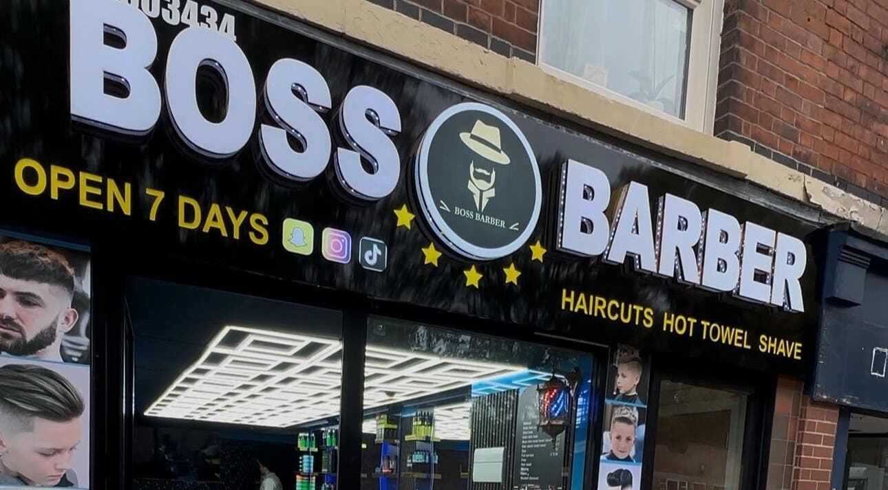 Front view of Boss Barber in Ilkeston, England showcasing a modern signboard and entry.