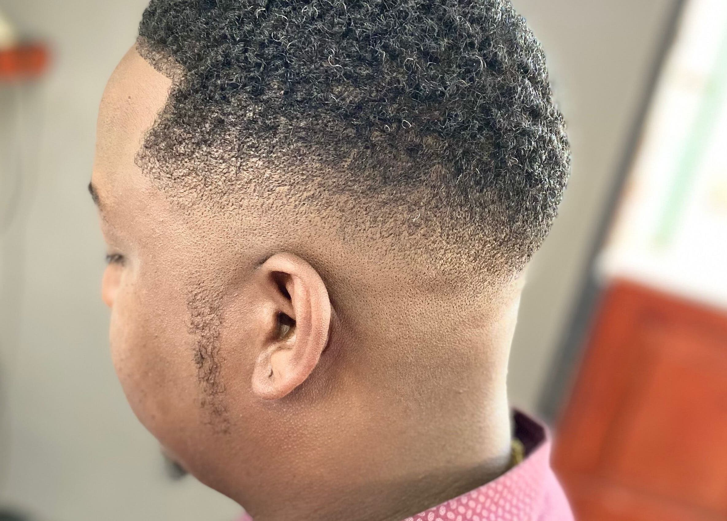 Close-up of a sharp fade haircut at Belly's Barbershop, Paramaribo, Paramaribo, SR.
