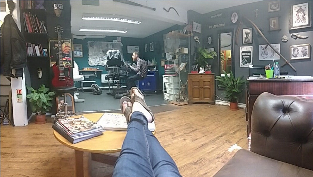 Inside view of Dustin Littles Tattoos studio in Harmony, North Carolina, US, showcasing a relaxed, creative space.