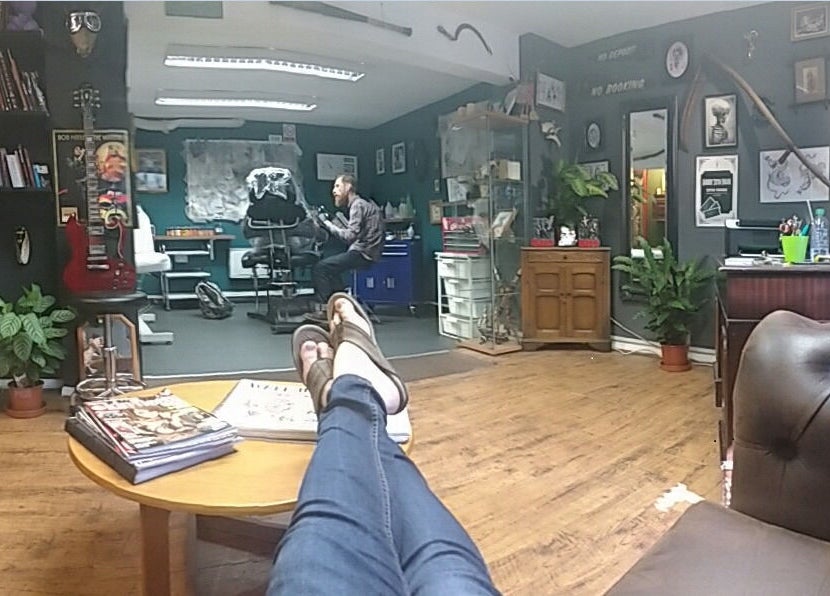 Inside view of Dustin Littles Tattoos studio in Harmony, North Carolina, US, showcasing a relaxed, creative space.