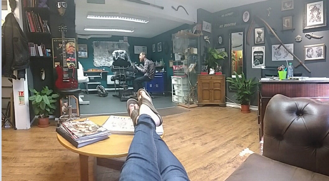 Inside view of Dustin Littles Tattoos studio in Harmony, North Carolina, US, showcasing a relaxed, creative space.