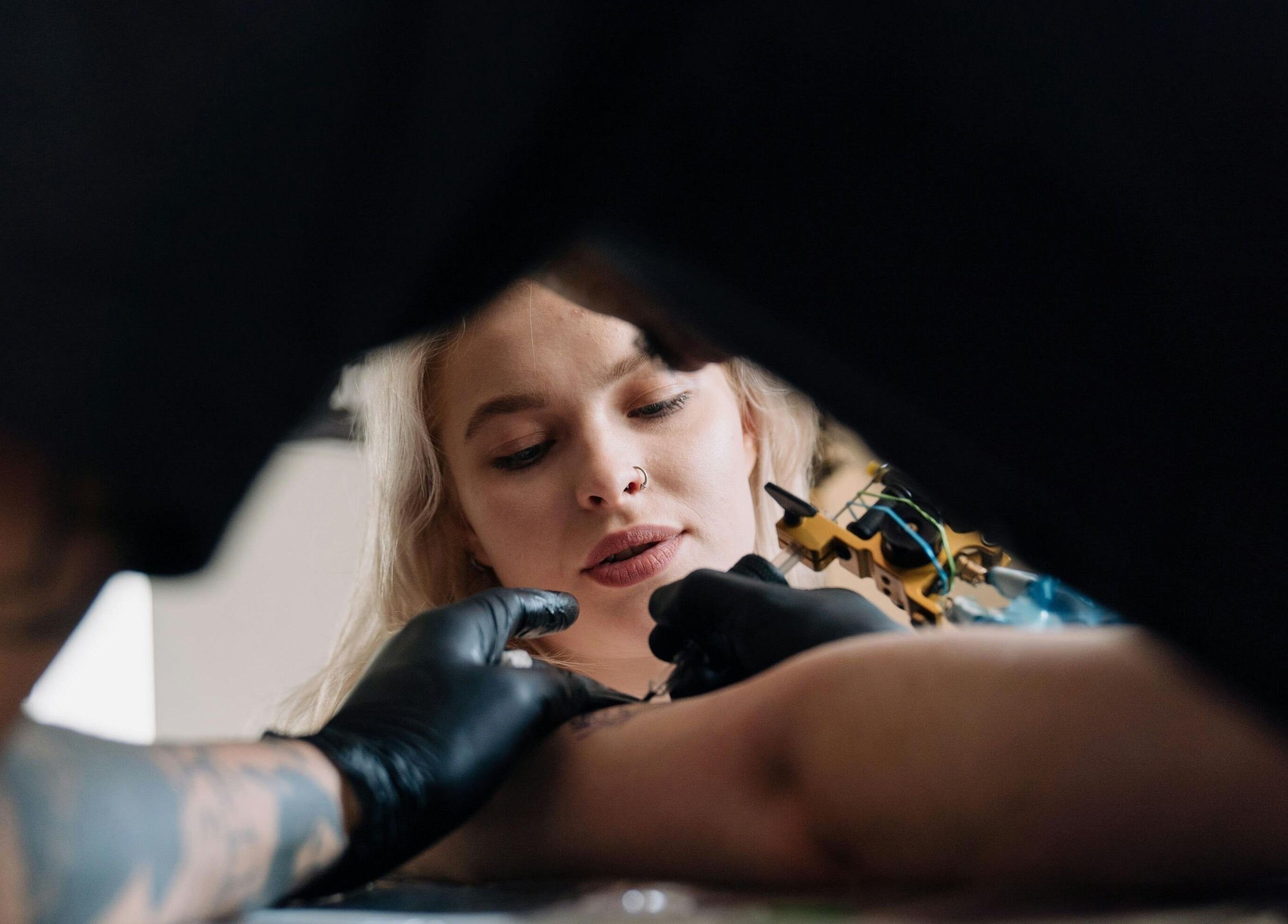 Tattoo artist at work at DUSTIN LITTLES TATTOOS in Harmony, North Carolina, US.