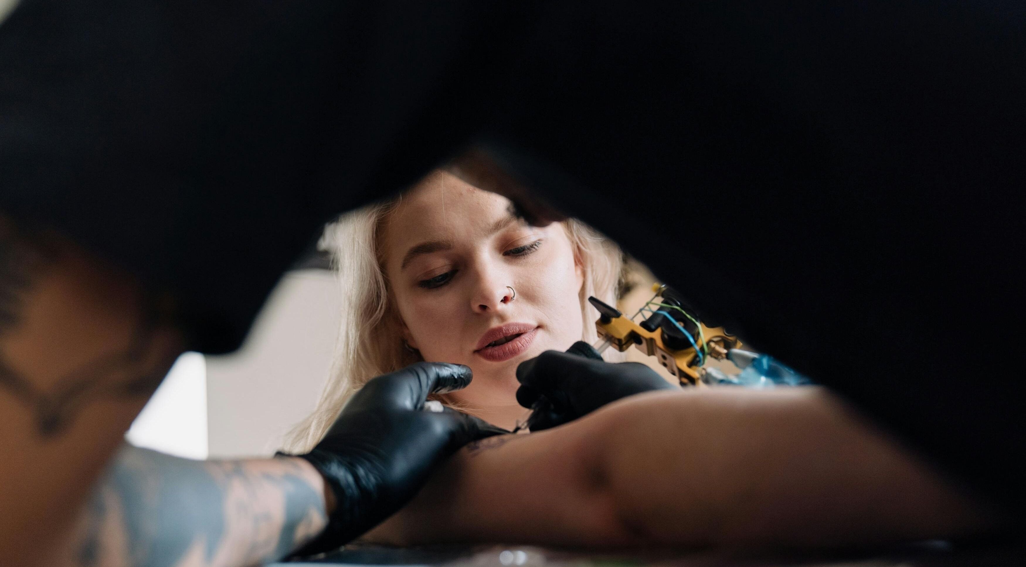 Tattoo artist at work at DUSTIN LITTLES TATTOOS in Harmony, North Carolina, US.