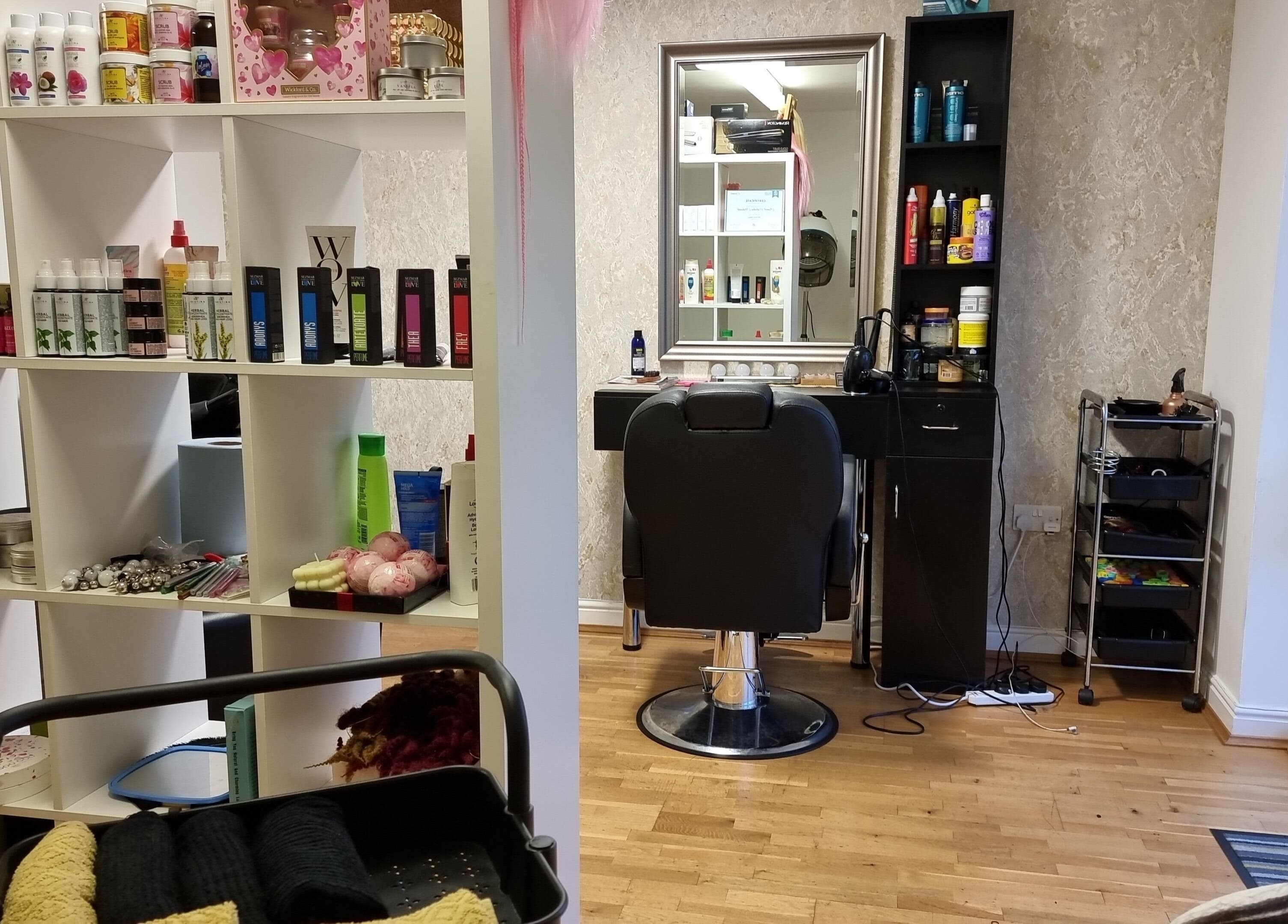 Hairbysaven#Savenwest salon interior at Ipswich, England, GB featuring stylish chair and product shelves.