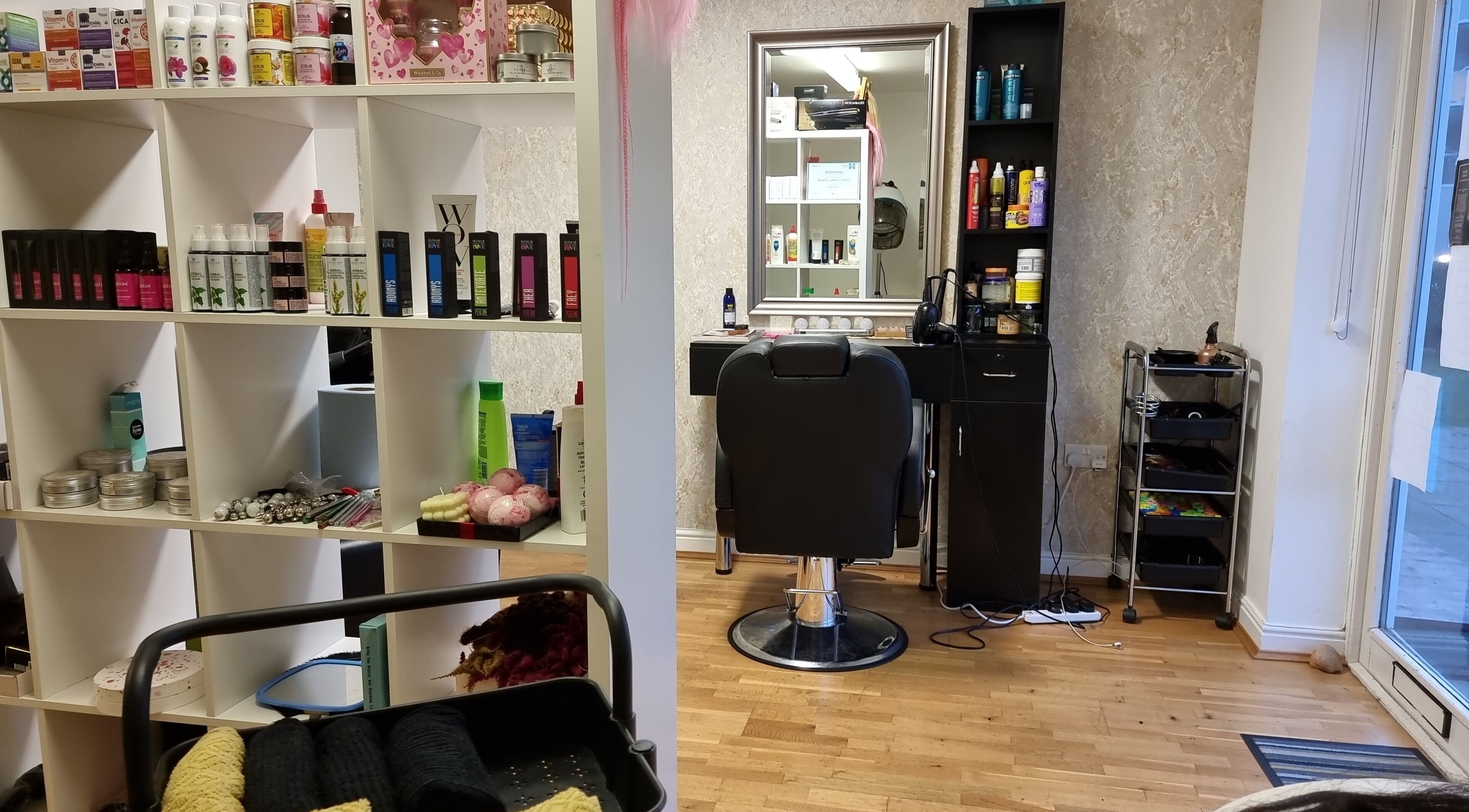 Hairbysaven#Savenwest salon interior at Ipswich, England, GB featuring stylish chair and product shelves.