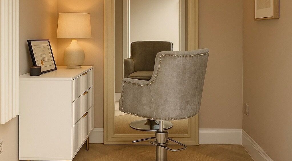 Cozy salon chair and mirror at Lauren Wellbeloved Hair in Orpington, England, GB. Inviting ambiance.