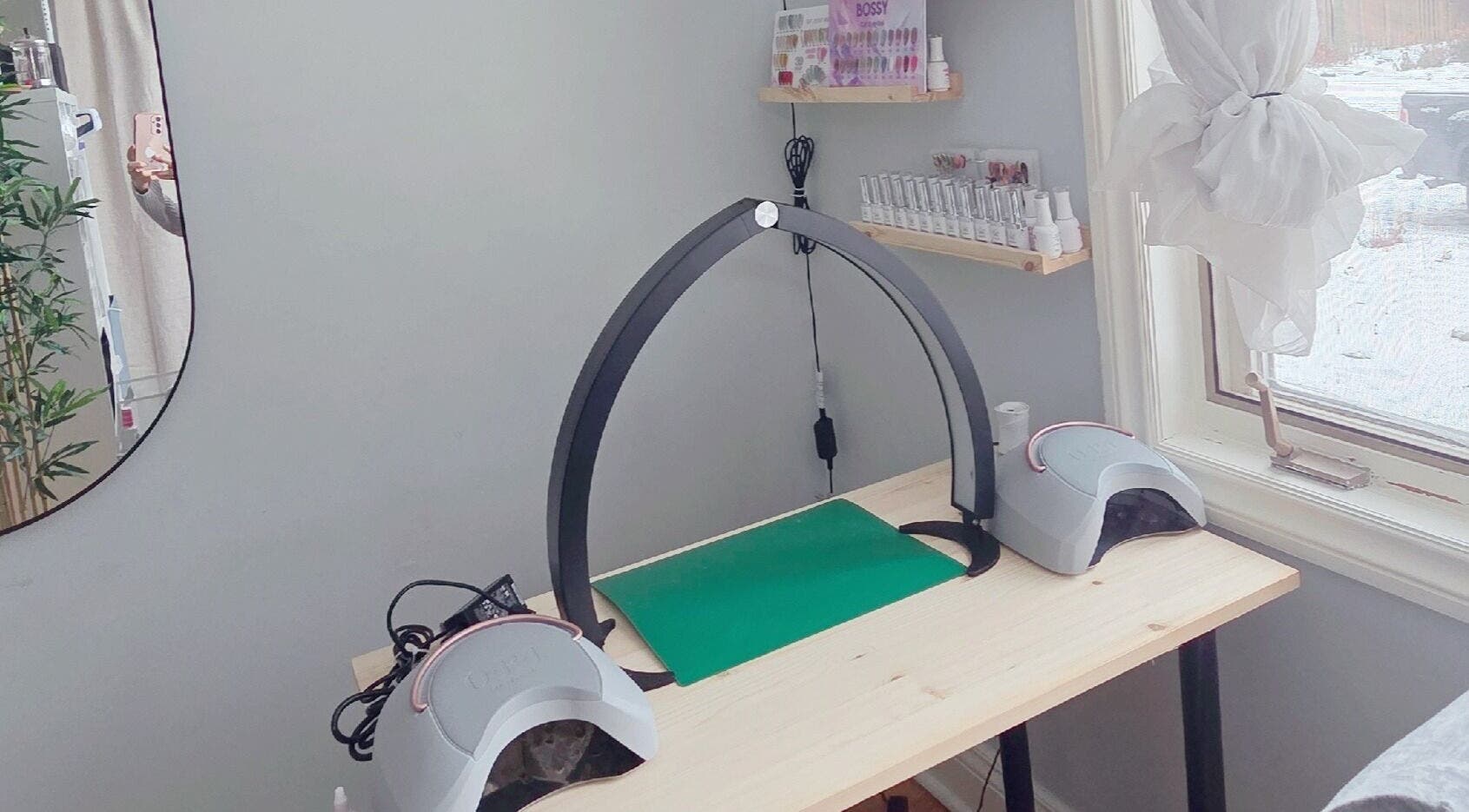 Nail station at Lumie Aure Beauty Studio in Ottawa, Ontario, CA, featuring modern equipment and natural light.