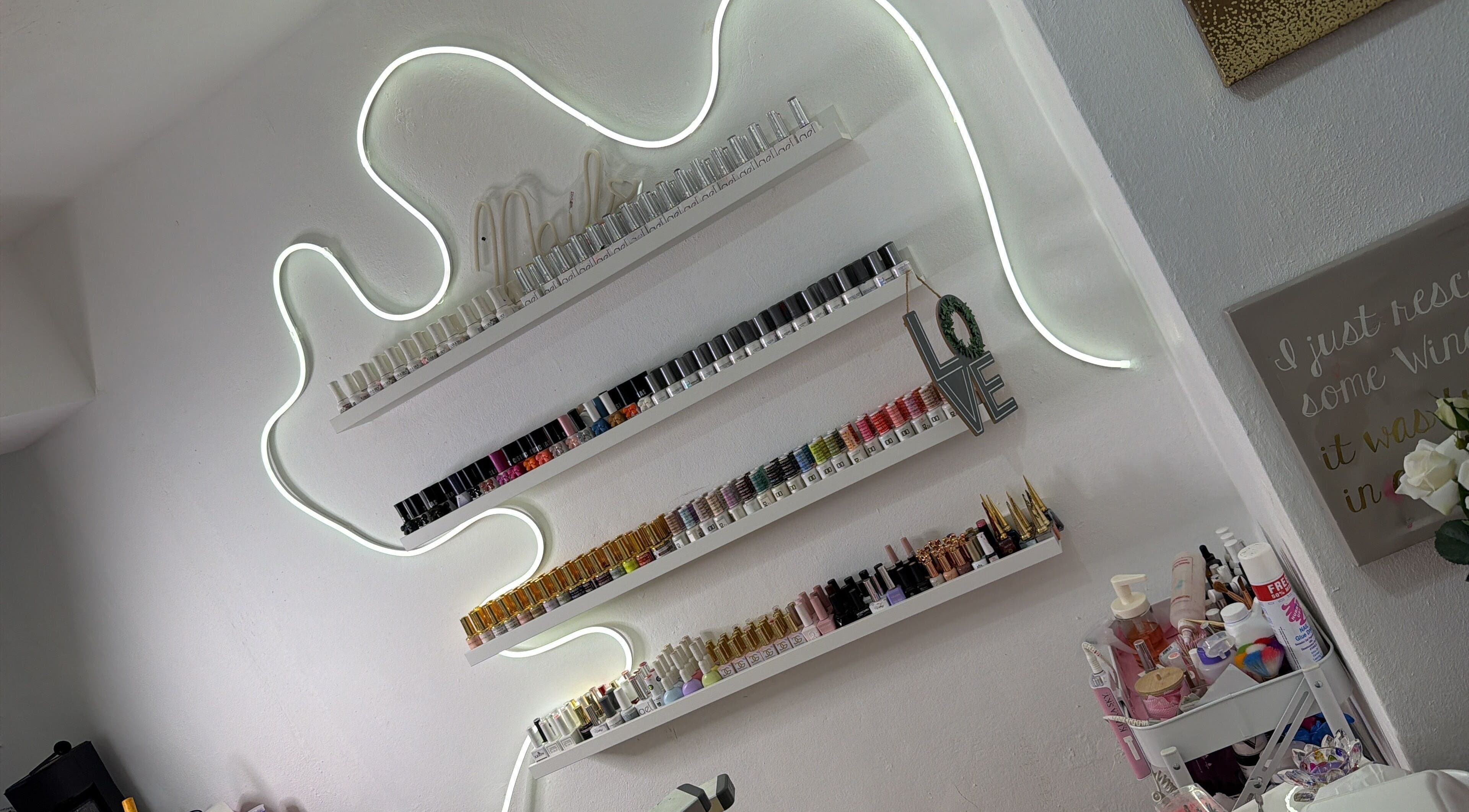 Elegant nail polish shelves at Nails by rossy, Santiago De Los Caballeros, Santiago, DO enhance the ambiance.