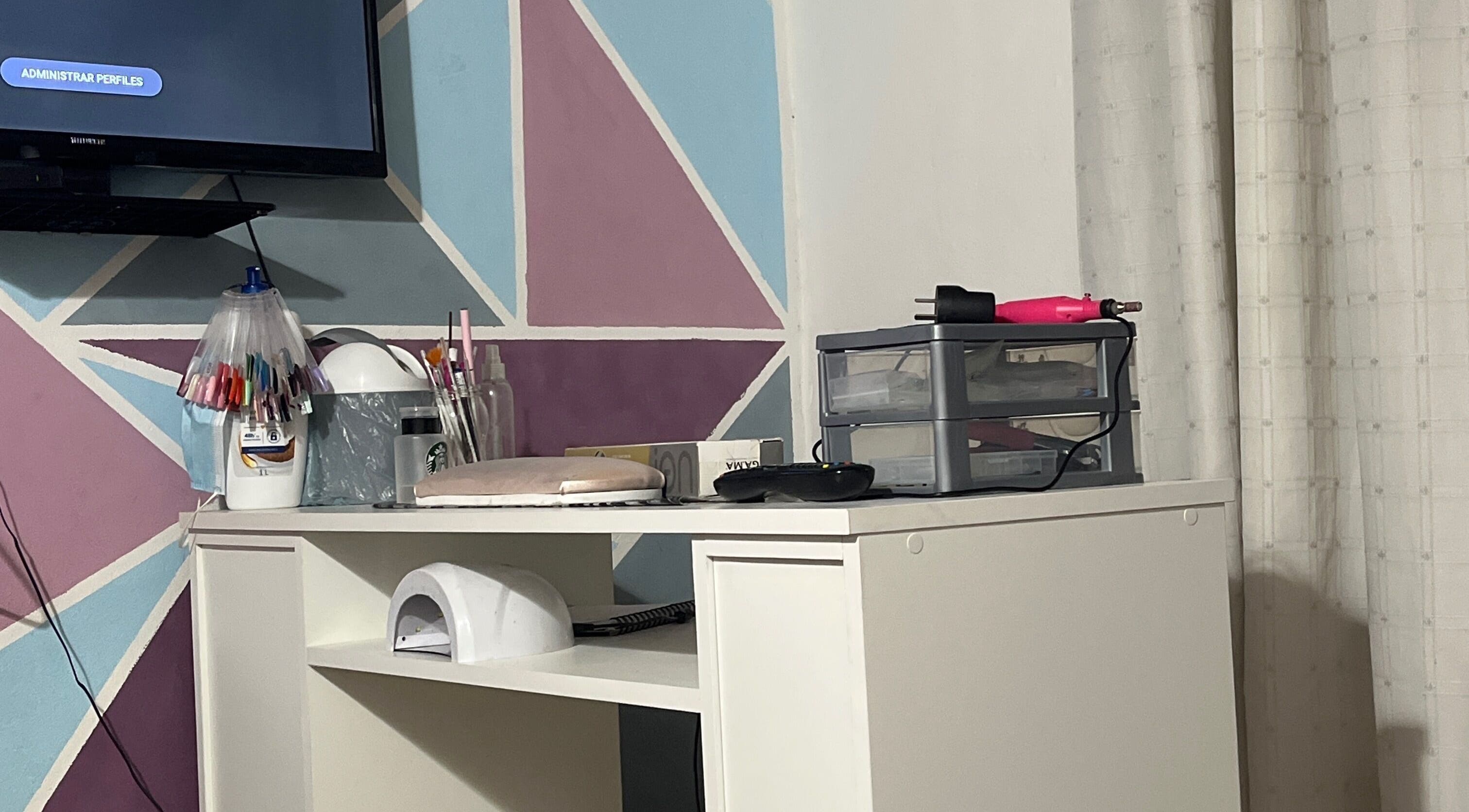 Loreley's nails workspace with colorful tools in General Pueyrredón, Provincia De Buenos Aires, AR.