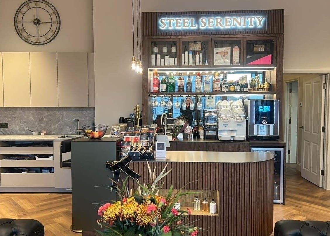 Aster Beauty at Steel Serenity's elegant bar area in Fakenham, England, offering premium refreshments.