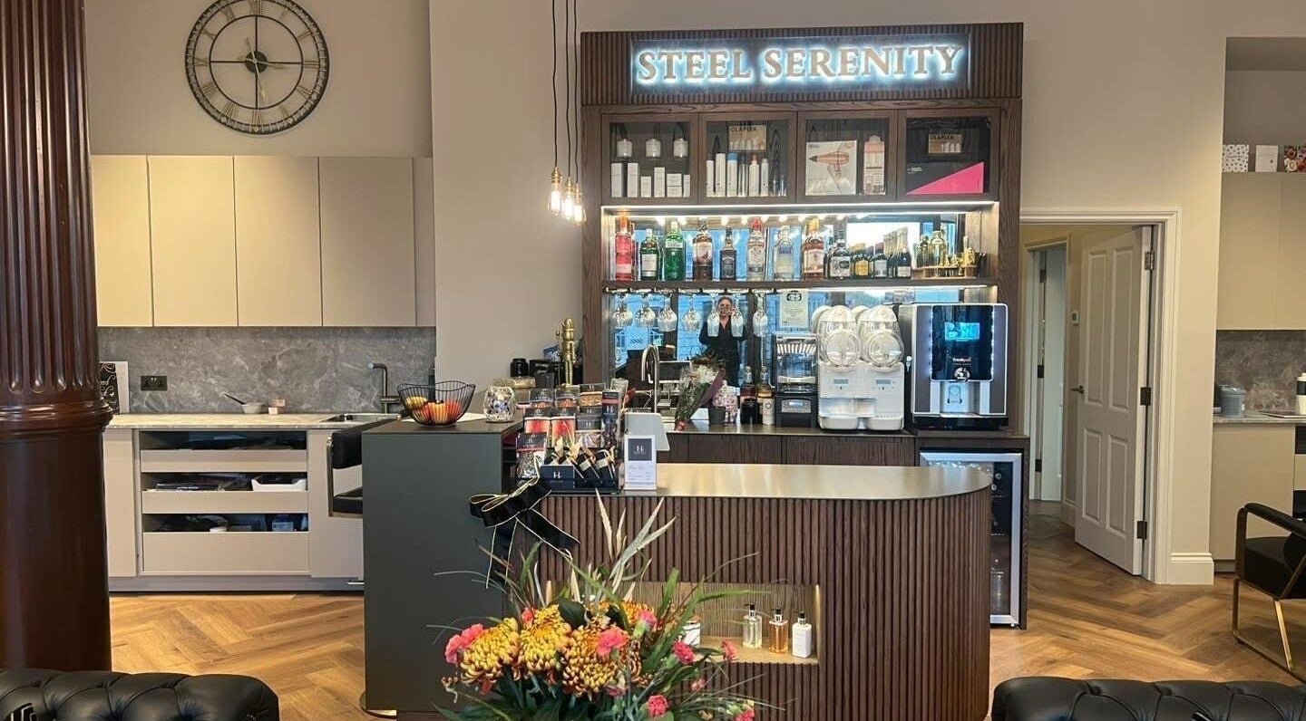 Aster Beauty at Steel Serenity's elegant bar area in Fakenham, England, offering premium refreshments.