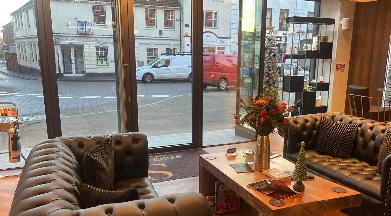 Modern lounge at Aster Beauty at Steel Serenity, Fakenham, England, GB featuring stylish sofas and decor.
