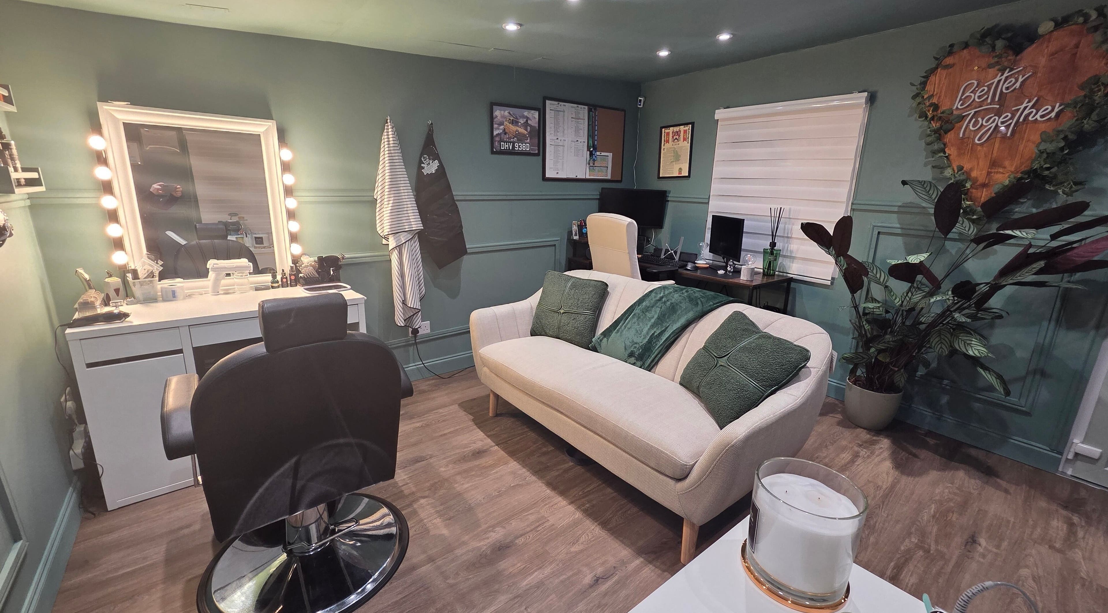 Stylish interior of The Green Room Barbers in Leeds, England, GB with modern decor and comfortable seating.