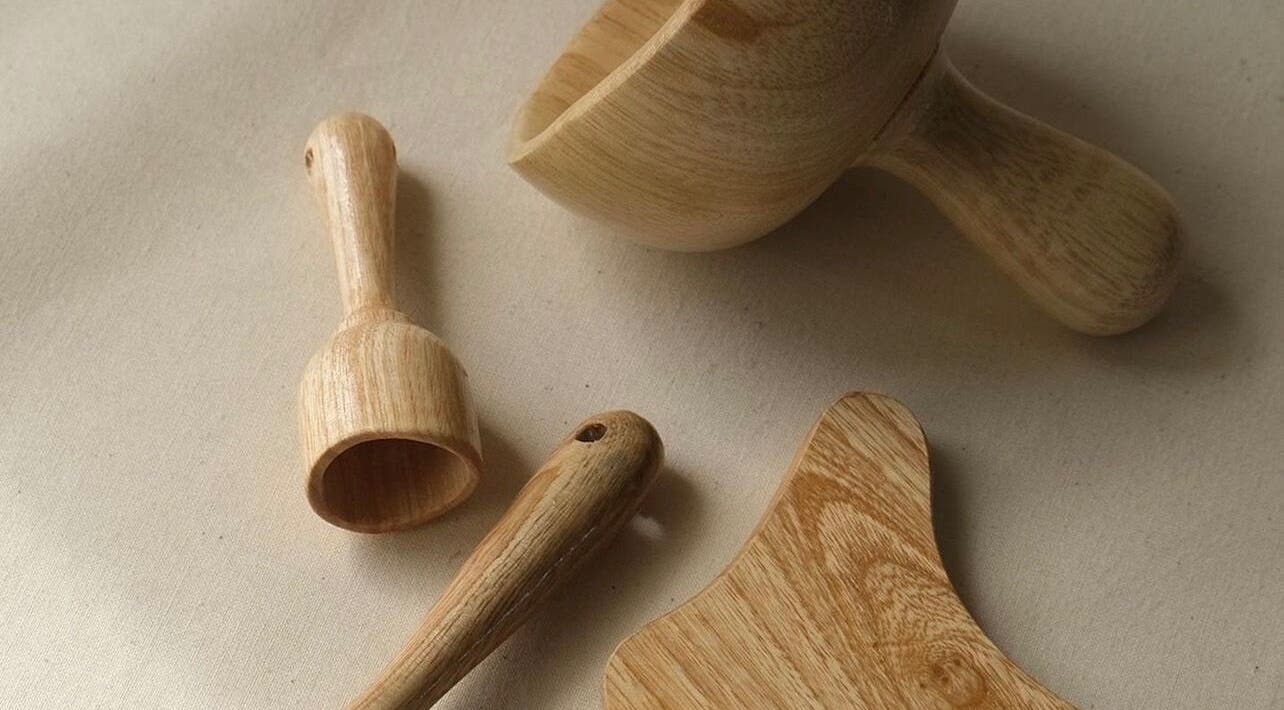 Natural wooden spa tools at Sculpt Studio in CA, perfect for wellness treatments.