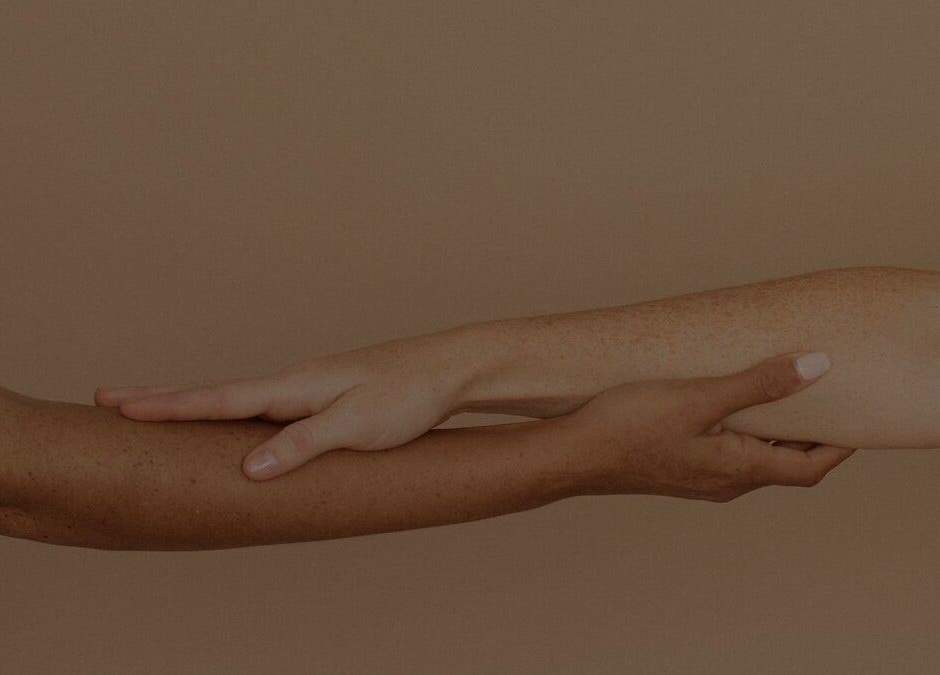 Two hands in soothing touch, symbolizing wellness at Sculpt Studio, Longueuil, Québec, CA.