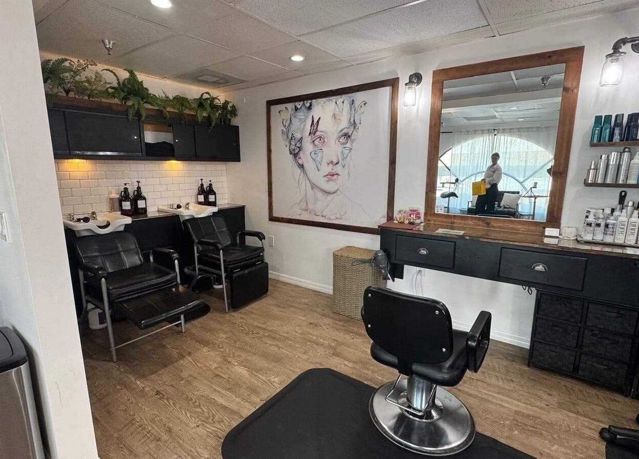 Stylish salon interior at Roxana Shine in Los Angeles, California, US, with artwork and hairdressing stations.
