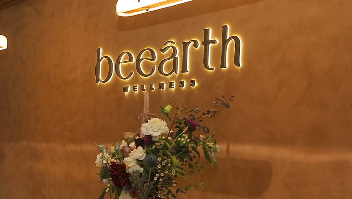 Be Earth Wellness entrance with floral decor, located on Hong Kong Island, Hong Kong Island, HK.