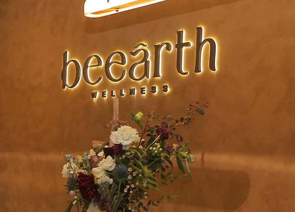 Be Earth Wellness entrance with floral decor, located on Hong Kong Island, Hong Kong Island, HK.