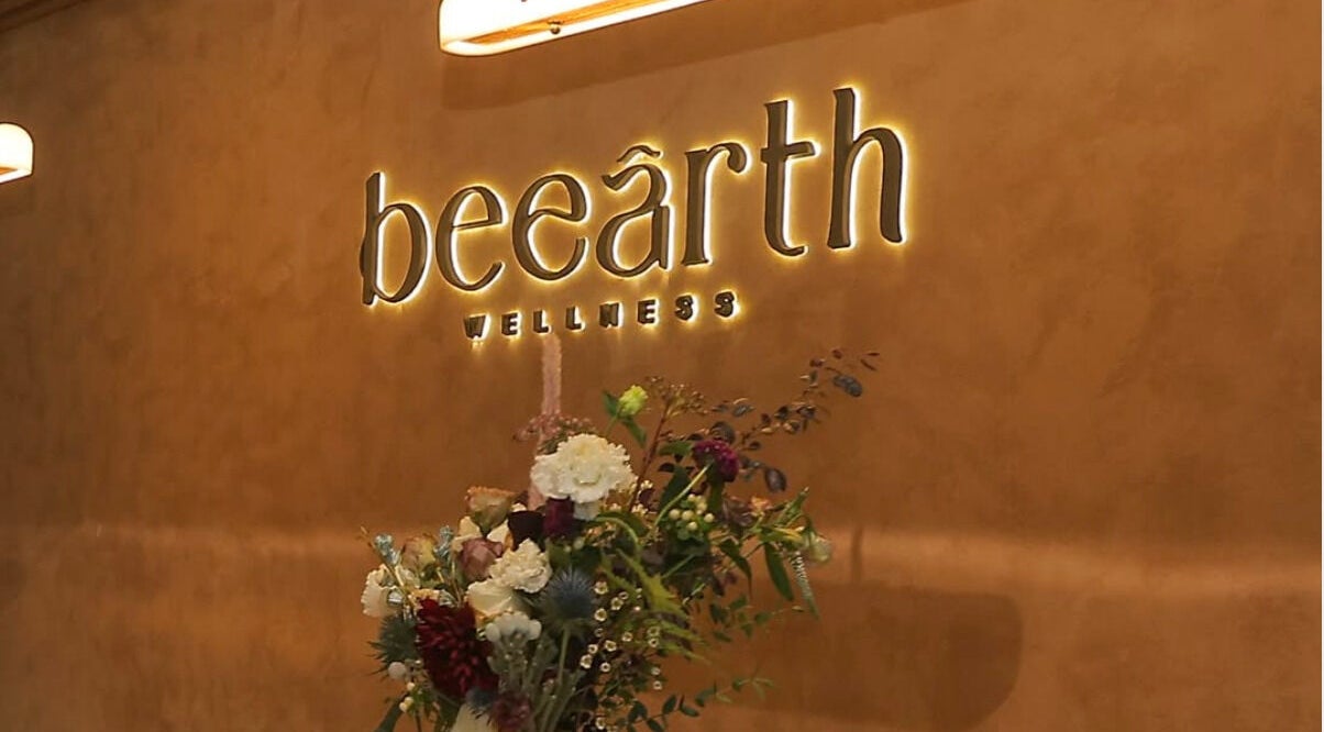 Be Earth Wellness entrance with floral decor, located on Hong Kong Island, Hong Kong Island, HK.