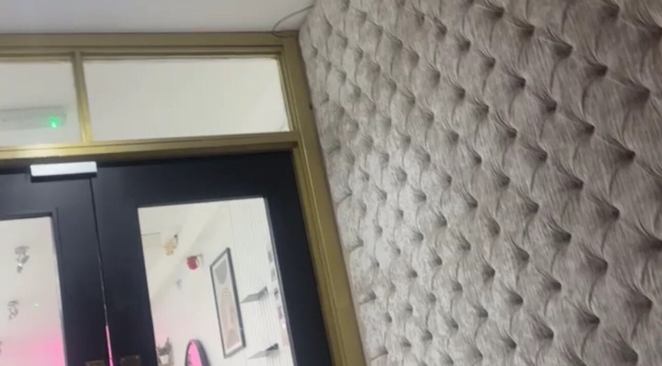 Stylish tufted wall near entrance at Hairlegance, Newcastle upon Tyne, England, GB.