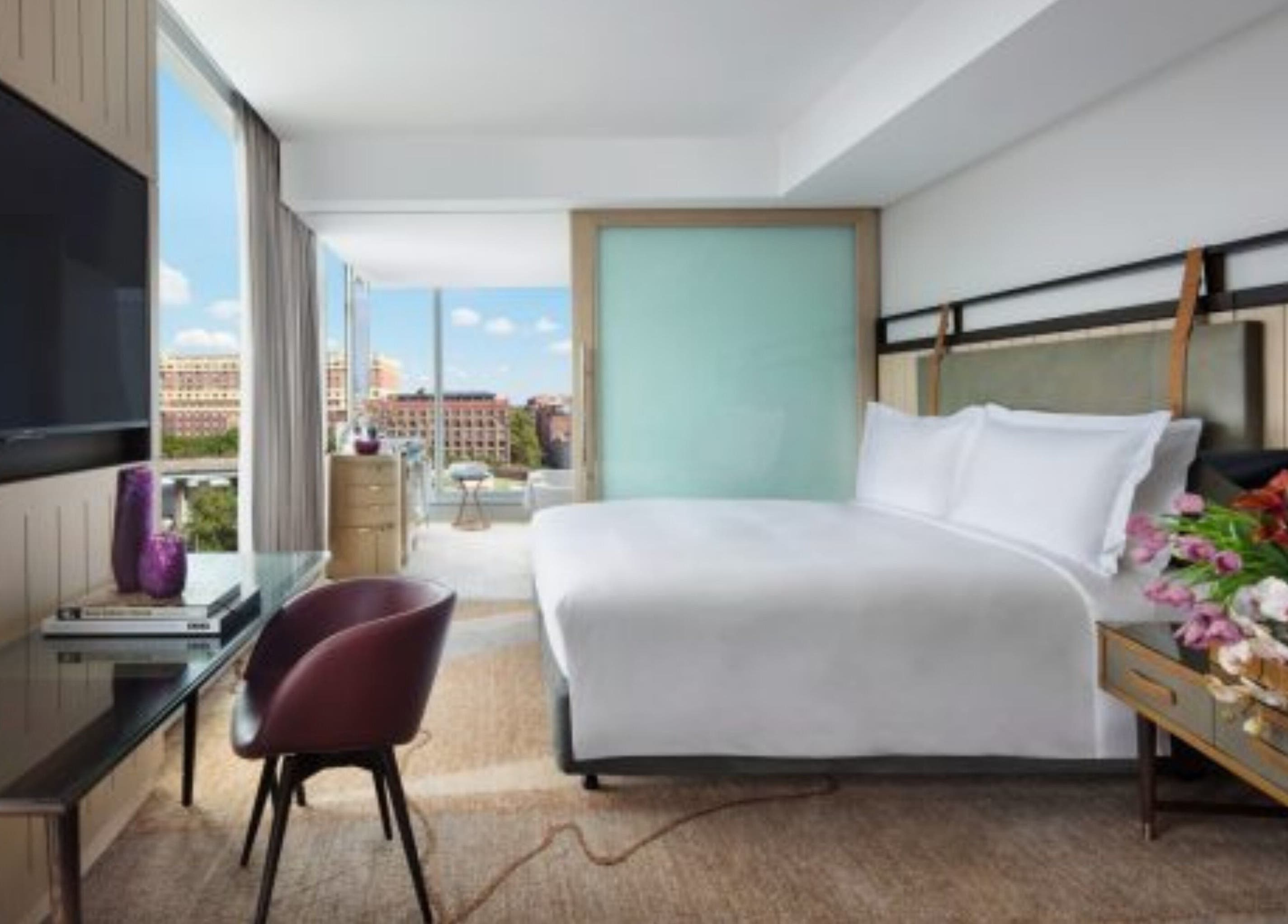 Luxurious bedroom at In-Room - Sofitel with a stunning city view in Sydney, New South Wales, AU.