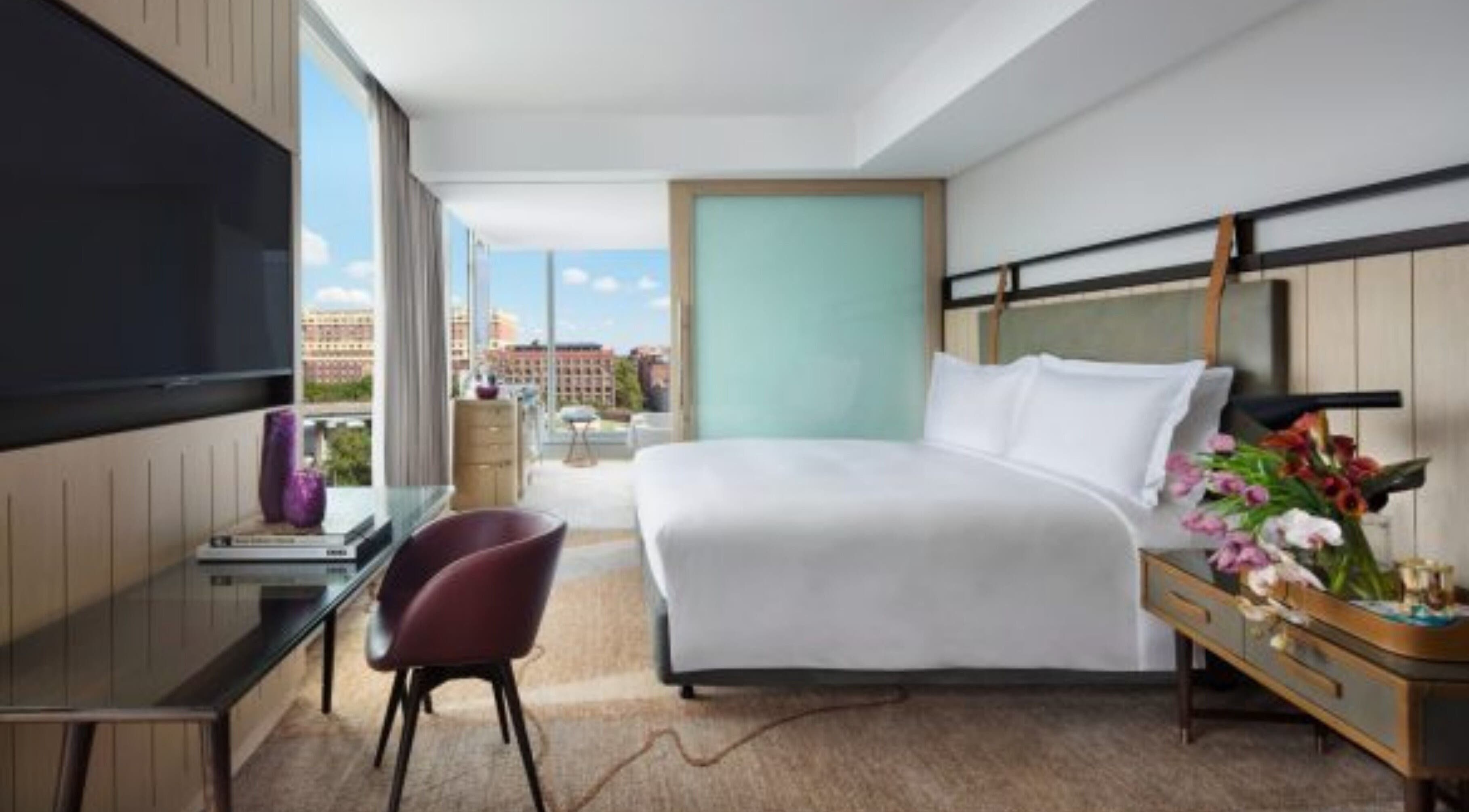Luxurious bedroom at In-Room - Sofitel with a stunning city view in Sydney, New South Wales, AU.