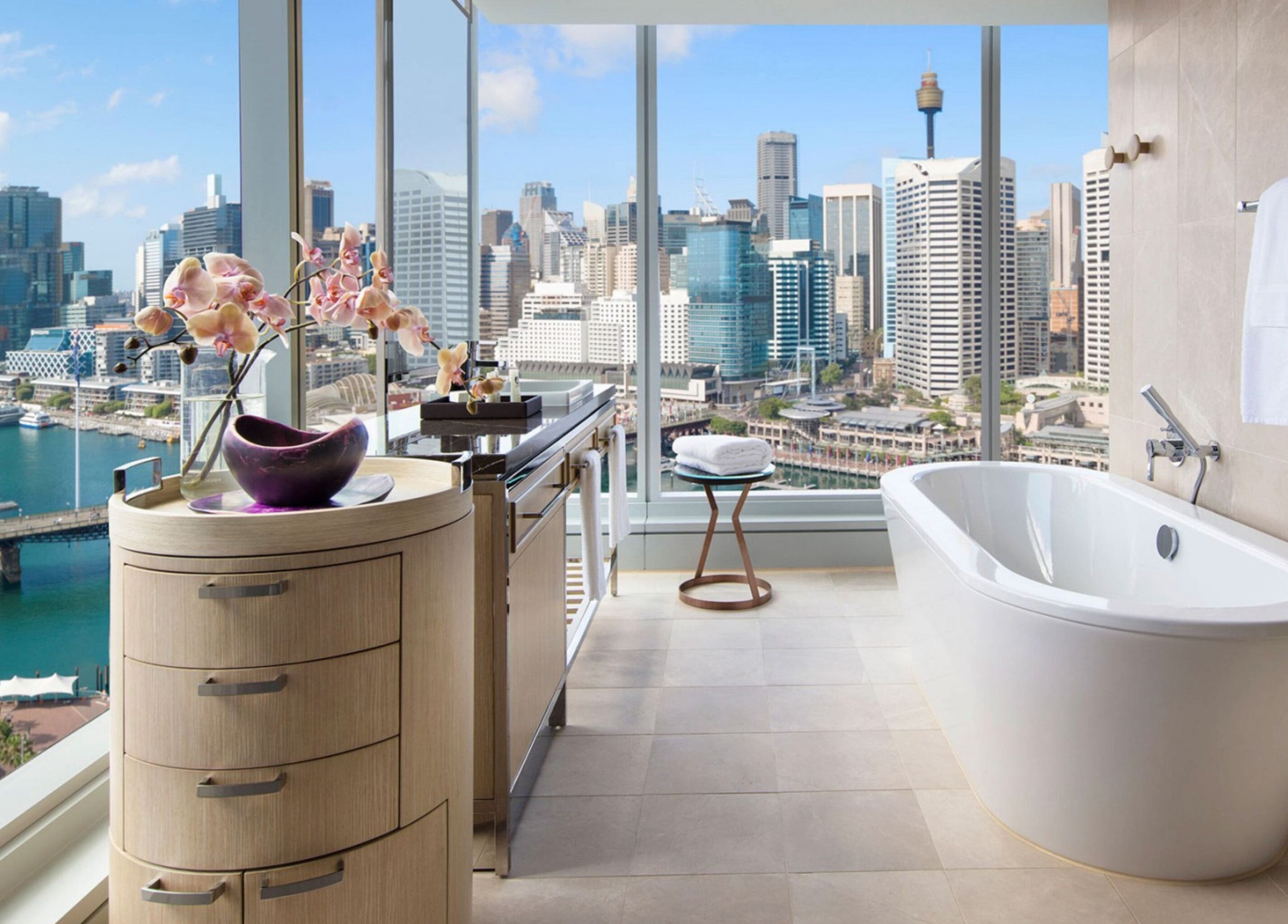 Luxurious bath with city skyline view at In-Room - Sofitel, Sydney, New South Wales, AU.