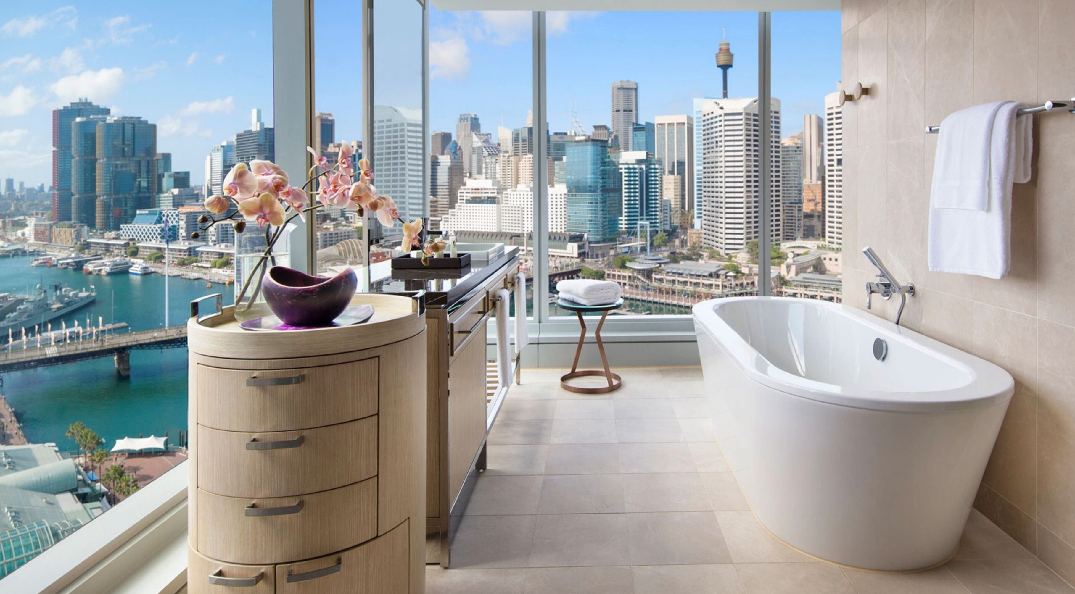 Luxurious bath with city skyline view at In-Room - Sofitel, Sydney, New South Wales, AU.