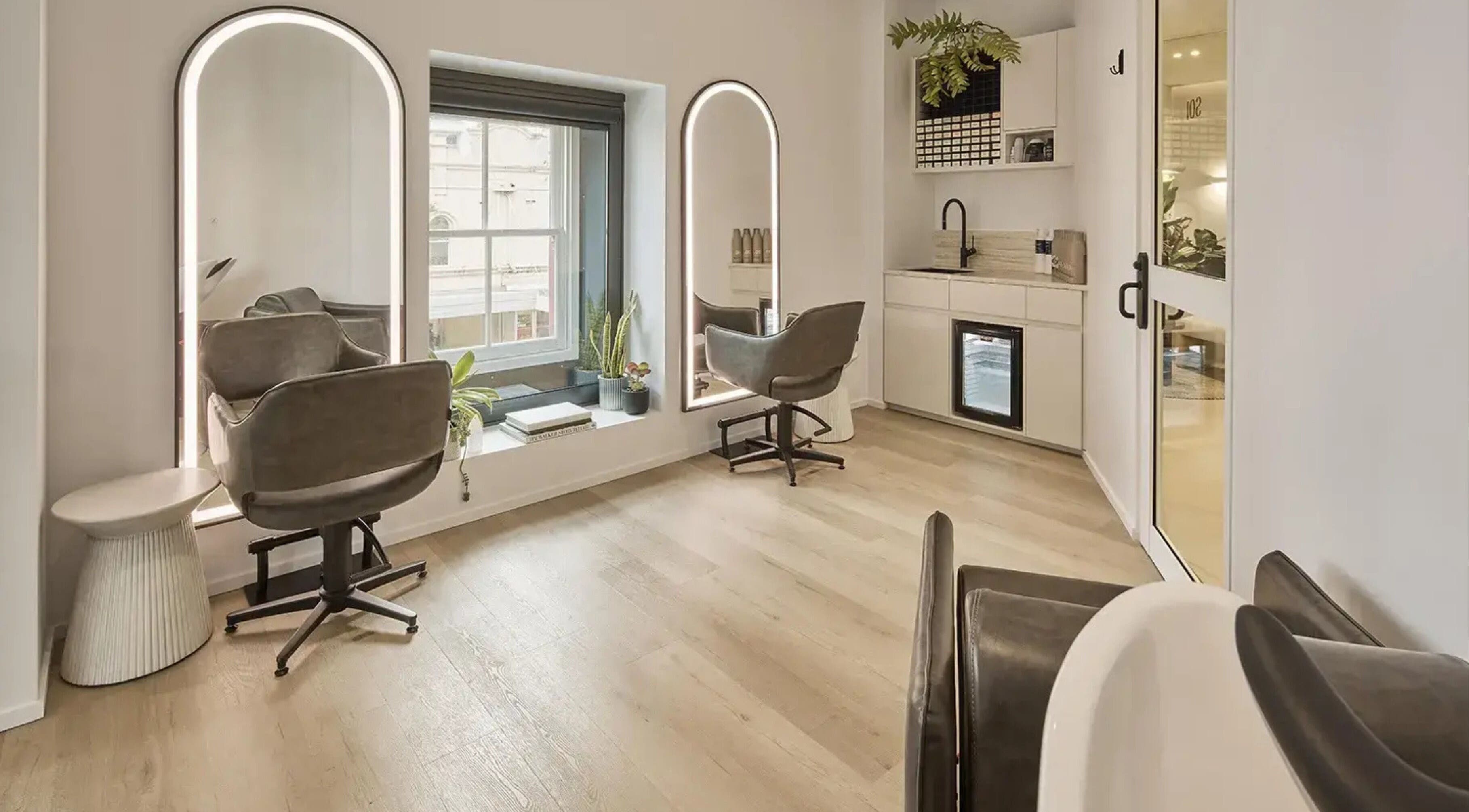 Chic interior of Pamper Packages at Salon Lane in Bondi Junction, New South Wales, AU, showcasing stylish chairs.