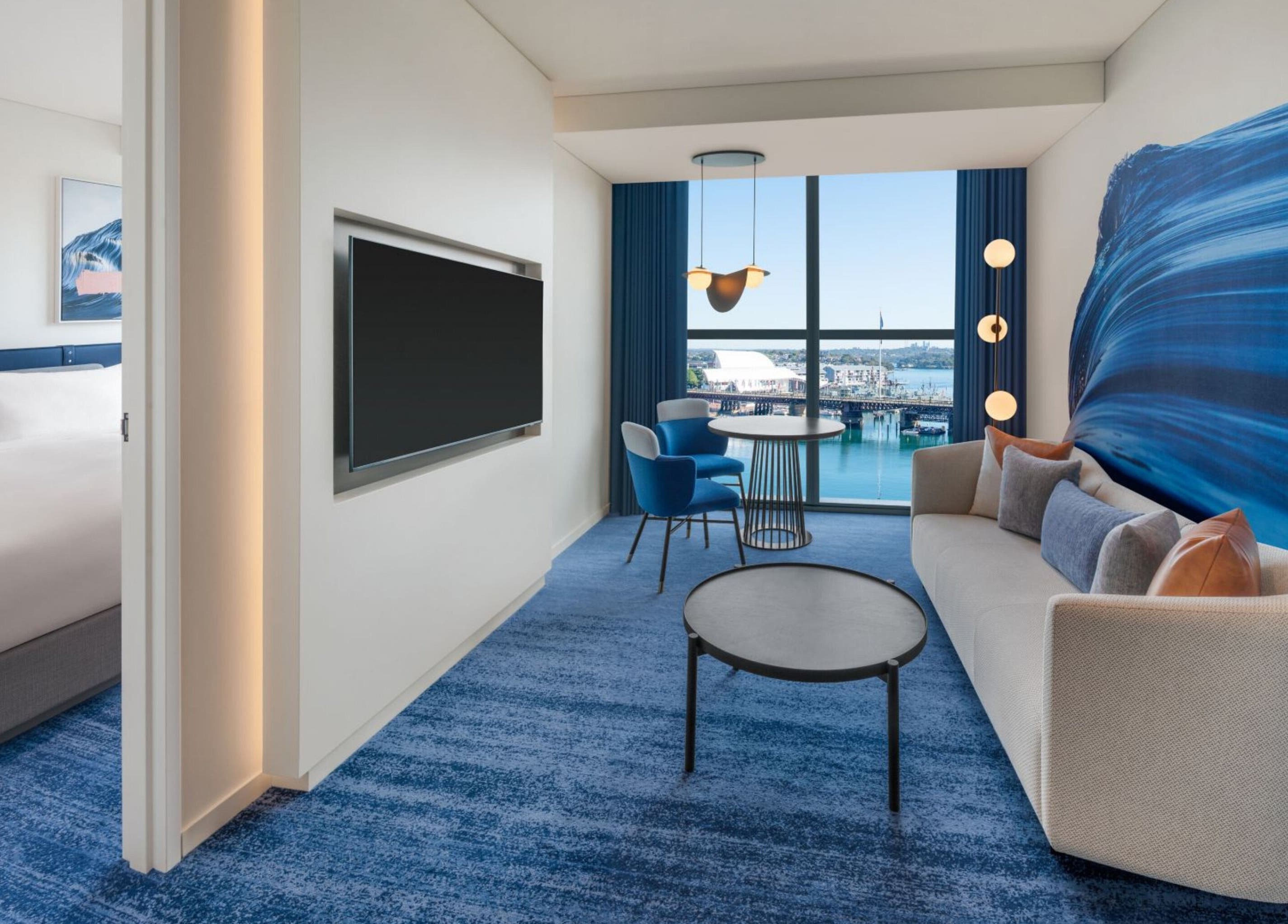 Stylish suite at In-Room - W Hotel with harbor view, Sydney, New South Wales, AU. Elegant decor and modern amenities.