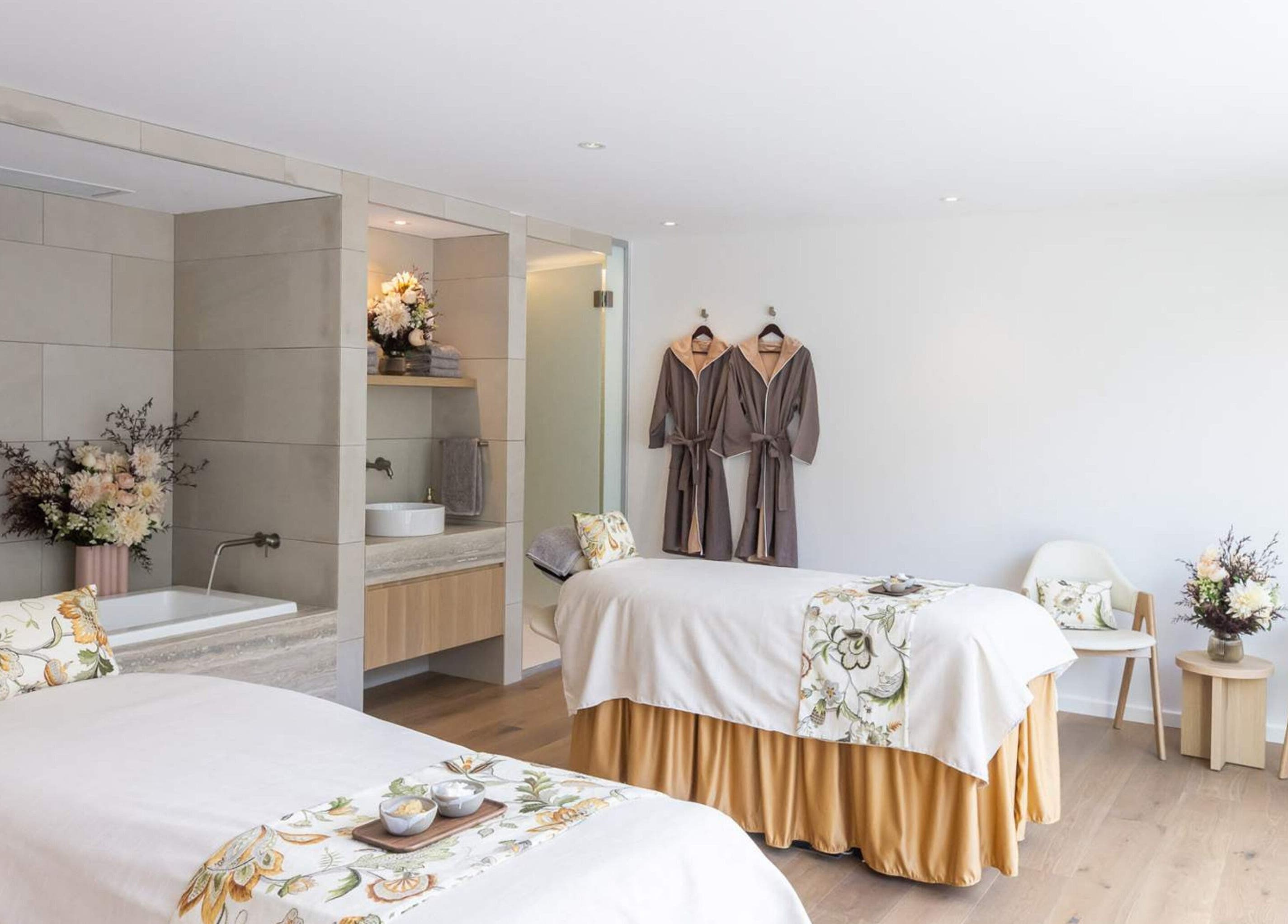 Elegant spa room at Sofitel Spa, Sydney, New South Wales, AU with twin massage beds and soothing decor.