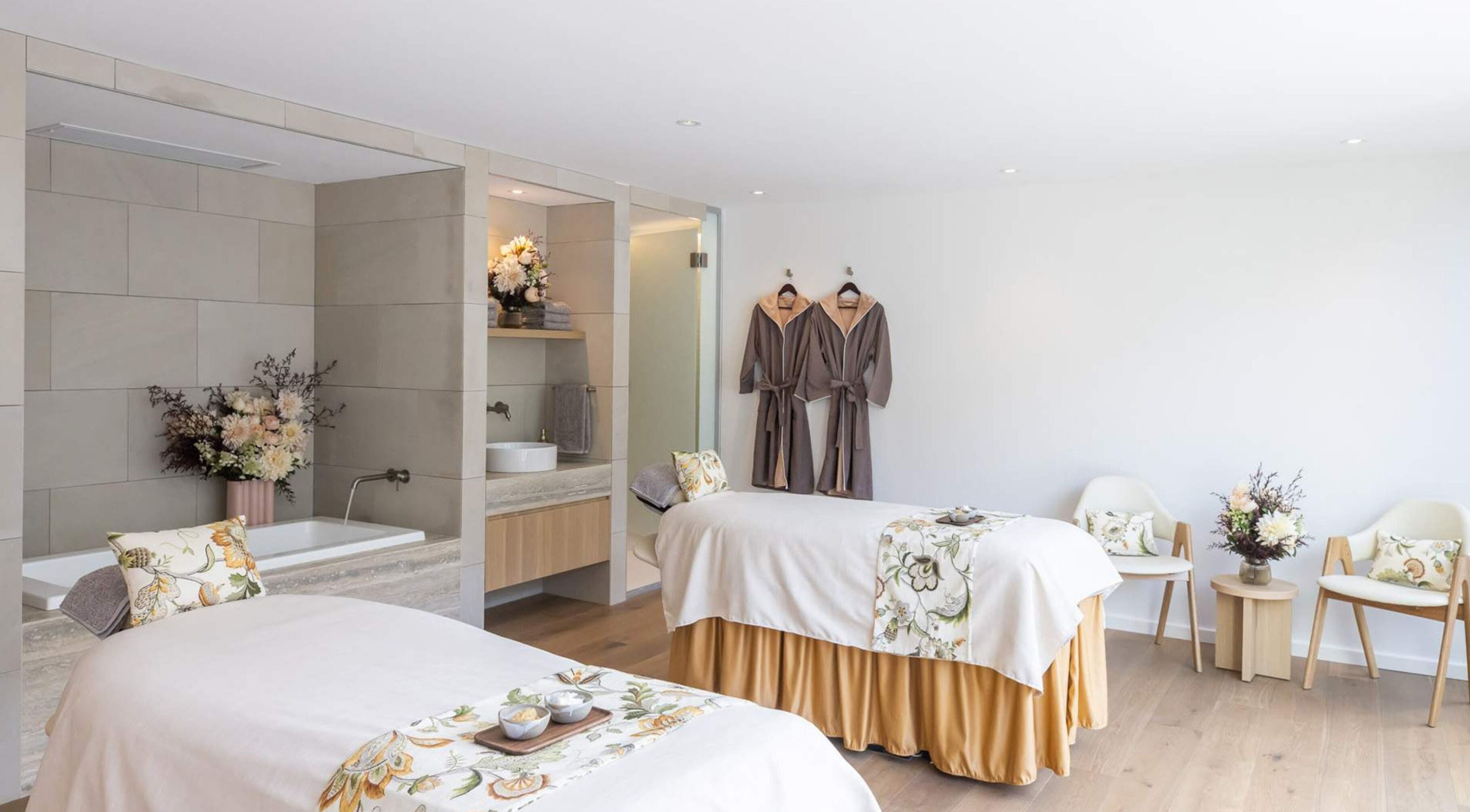 Elegant spa room at Sofitel Spa, Sydney, New South Wales, AU with twin massage beds and soothing decor.