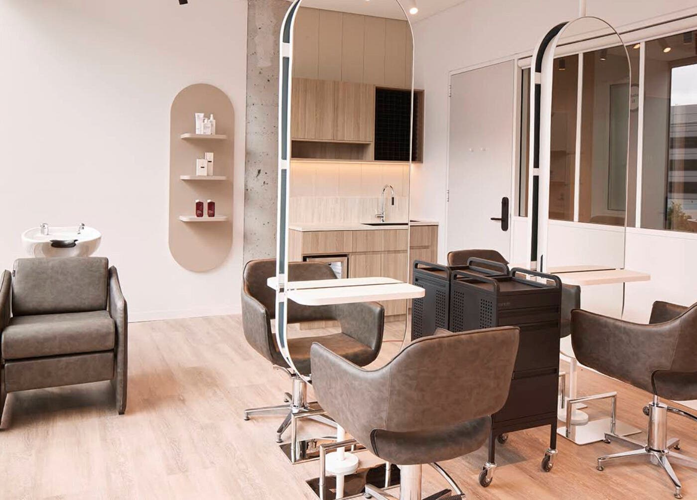 Modern salon interior at Salon Lane, St Leonards, New South Wales, AU with stylish chairs and large mirrors.