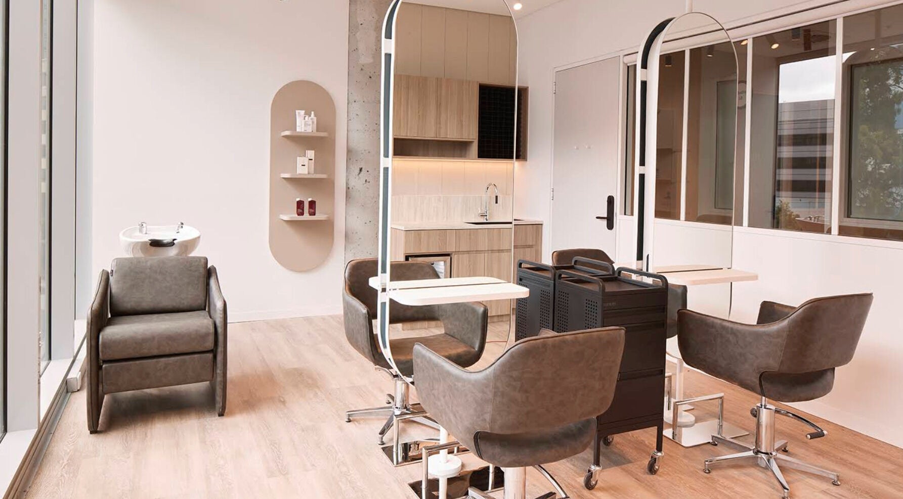Modern salon interior at Salon Lane, St Leonards, New South Wales, AU with stylish chairs and large mirrors.