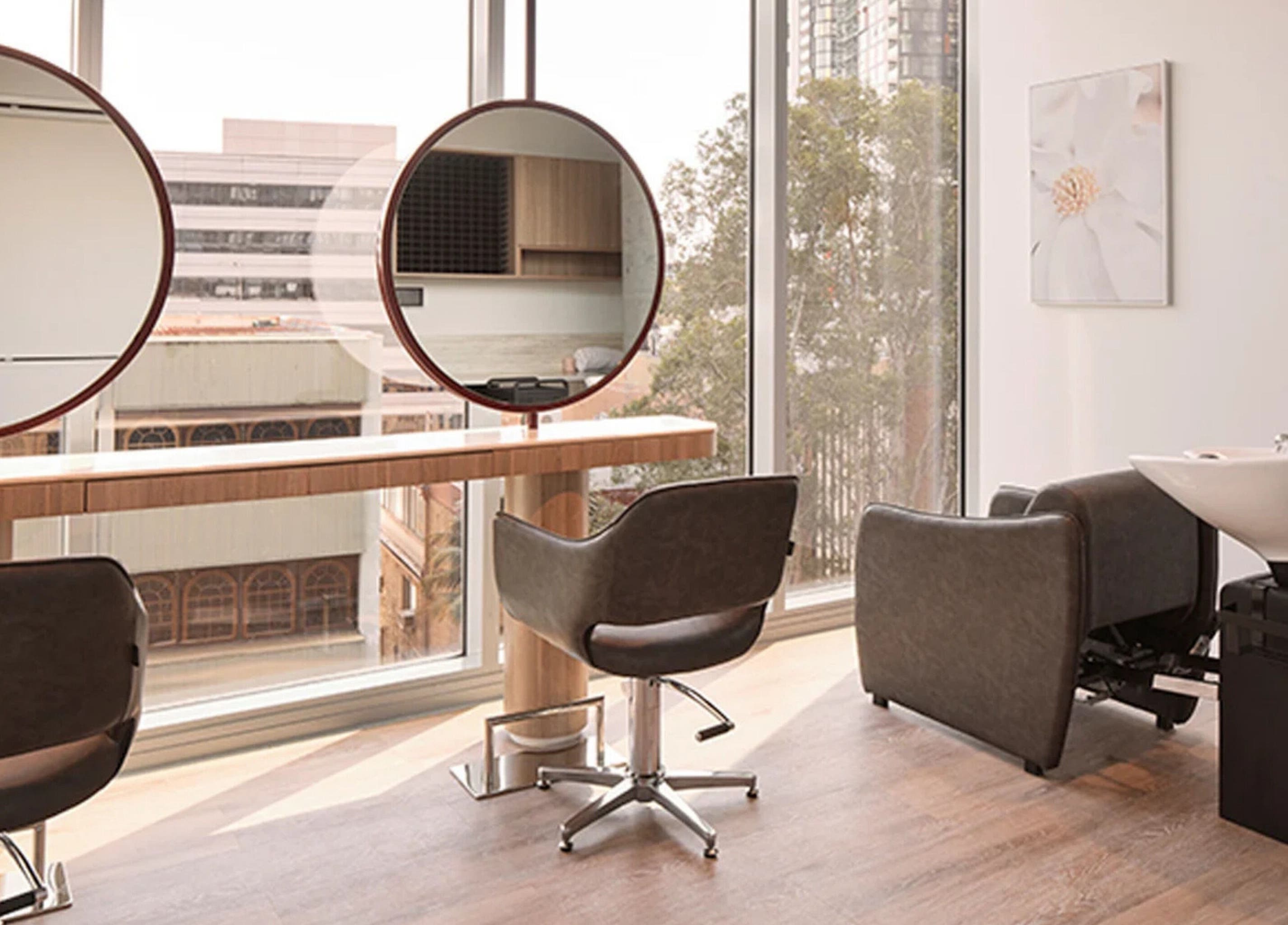 Elegant salon setup at Salon Lane in St Leonards, New South Wales, AU with modern chairs and large windows.