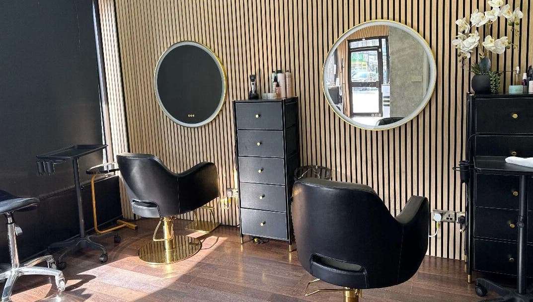 Modern salon chairs and mirrors at Nuvia Beauty London, London, England, GB.