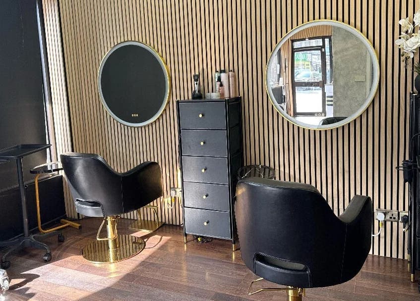 Modern salon chairs and mirrors at Nuvia Beauty London, London, England, GB.